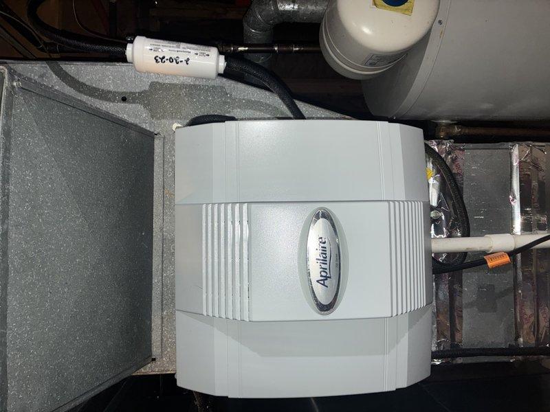 Completed routine MVP heating maintenance on a 7-year-old system. Inspected and documented condition of the Aprilaire humidifier unit mounted to ductwork, verifying proper installation of filter and connections. Examined galvanized ductwork system for integrity and dust accumulation, checked condensate drainage lines, and assessed overall system operation.