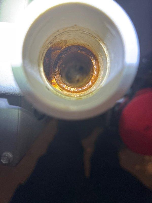 Completed routine heating maintenance on customer's HVAC system. Inspected Honeywell control valve and pressure switch components, finding all electrical connections secure and operational. Identified significant corrosion and mineral buildup in condensate drain pipe requiring cleaning to prevent potential blockage and system efficiency issues.