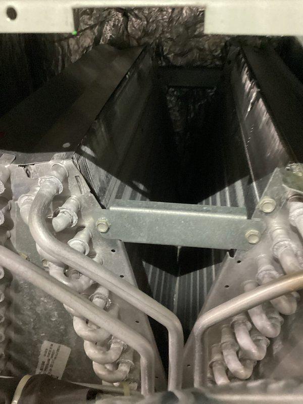 Performed diagnostic inspection on furnace that had temporarily stopped working. Conducted combustion analysis test with Bacharach analyzer showing efficient operation (88.5% efficiency) with normal CO levels (16ppm) and CO₂ at 7.0%. Inspected heat exchanger and cooling coil assembly; all components functioning properly with no visible defects or safety concerns.