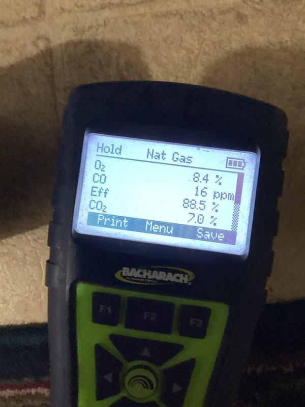 Performed diagnostic inspection on furnace that had temporarily stopped working. Conducted combustion analysis test with Bacharach analyzer showing efficient operation (88.5% efficiency) with normal CO levels (16ppm) and CO₂ at 7.0%. Inspected heat exchanger and cooling coil assembly; all components functioning properly with no visible defects or safety concerns.