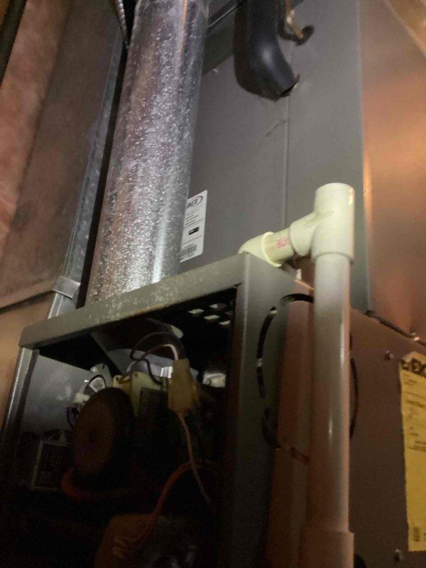 Diagnosed and serviced 20+ year old heating system that had failed to operate. Located significant condensation on ductwork and housing, inspected the condensate drain system, and found internal control board issues requiring repair to restore heating function.