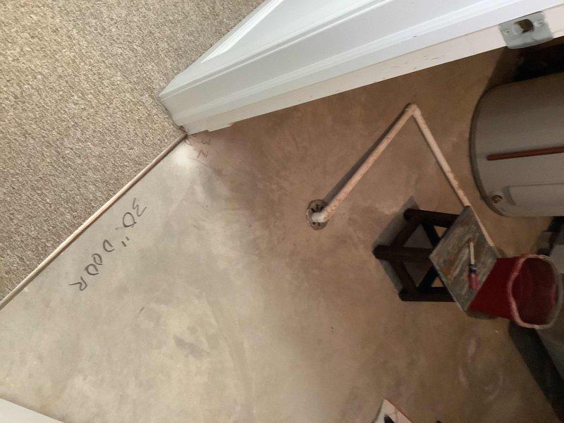 Responded to emergency service call for a leaking tanked water heater. Upon inspection, identified water damage on surrounding walls and floor, with active leakage requiring containment (bucket placed to collect water). Visual assessment revealed the tank had reached end of life with significant corrosion at connection points. Recommended full replacement of unit.