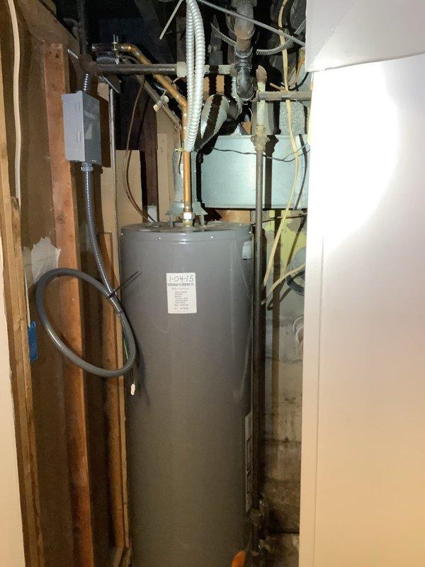Successfully removed existing gas water heater and installed new electric water heater in utility room, completing all necessary plumbing connections and preparing for electrical connection to be performed by electrician on scheduled date.