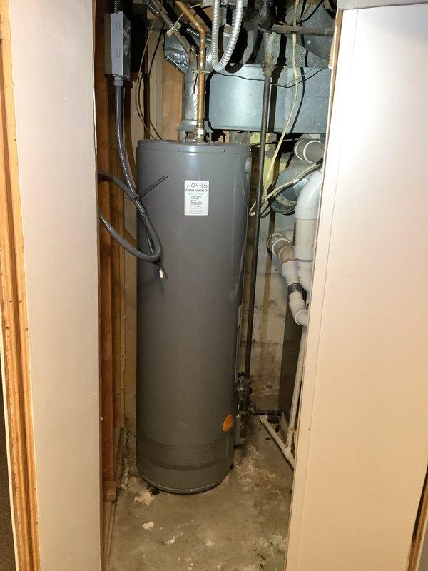 Successfully removed existing gas water heater and installed new electric water heater in utility room, completing all necessary plumbing connections and preparing for electrical connection to be performed by electrician on scheduled date.