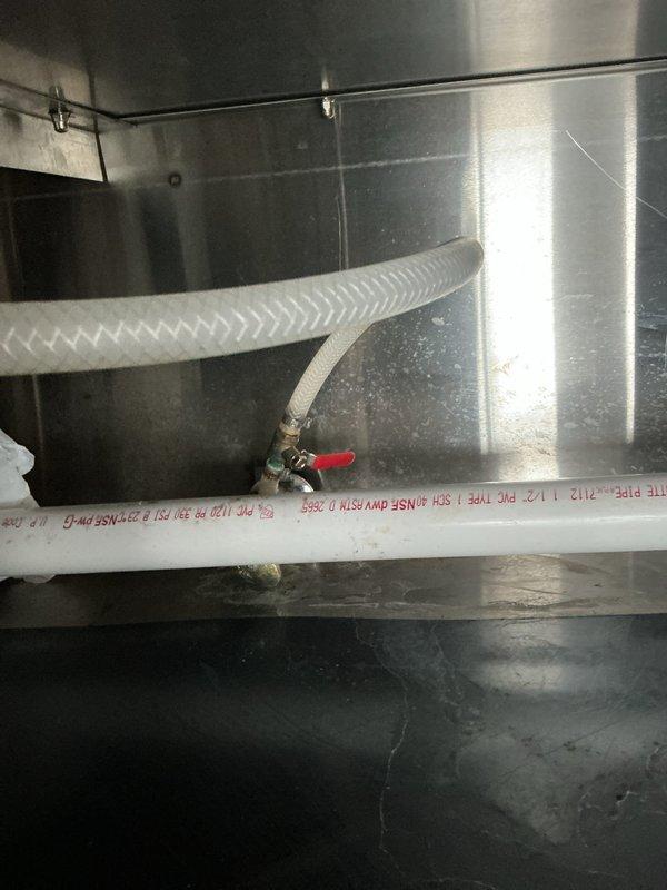 Completed thorough inspection of commercial filtration system including pressure gauges, valves, and associated PVC piping. Examined water line connections and valve functionality within metal enclosure. Documented current system condition with photos for reference.