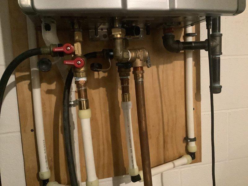 Successfully completed descaling service on Rinnai tankless water heater, removing mineral deposits using appropriate flush method. Inspected all plumbing connections including copper supply lines, PVC drainage, and verified proper operation of shut-off valves. System was tested after service and confirmed to be functioning optimally with control panel displaying normal operation.