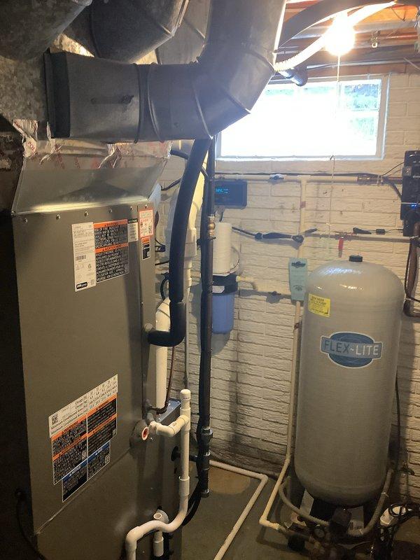 Completed installation of Lennox outdoor condensing unit as scheduled follow-up service. Unit was properly positioned on exterior wall adjacent to utility room housing the previously installed air handler. System was tested and verified operational with all connections properly sealed and insulated. Installation completed despite winter conditions.