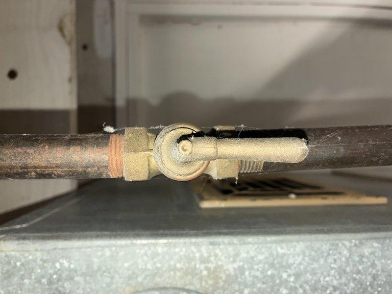 Performed scheduled heating maintenance visit on residential HVAC system. Inspected air filter housing and confirmed filter is properly installed with no visible damage. Examined gas valve and copper supply lines for proper operation and signs of leakage; all components functioning normally with no issues detected.