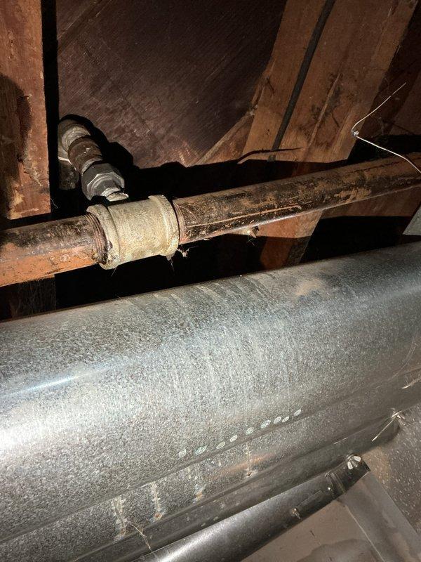 Responded to service call for gas leak at a 3/4x1/2 coupler. Removed heating vents to access affected area, cut the corroded gas line, and installed new press fittings to properly seal the connection. Pressure tested system to confirm successful repair and elimination of leak.
