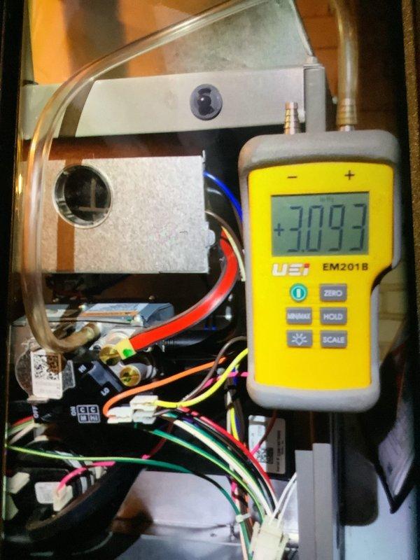 Conducted scheduled preventive maintenance on furnace system as part of recurring service program. Inspected air filter which showed moderate dust accumulation, and performed system diagnostic testing using UEI EM201B meter which registered a reading of +3093. Visual inspection of internal wiring connections confirmed proper installation with all color-coded wires securely connected.
