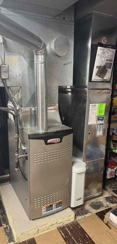 Performed comprehensive heating maintenance service on a Lennox furnace system. Inspected internal components including blower motor, electrical wiring, pressure switch, gas valve assembly and control board - all components functioning properly. System installation and ventilation ducting in basement utility room was verified to be in good working condition.