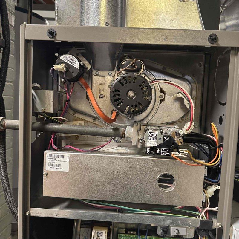 Performed comprehensive heating maintenance service on a Lennox furnace system. Inspected internal components including blower motor, electrical wiring, pressure switch, gas valve assembly and control board - all components functioning properly. System installation and ventilation ducting in basement utility room was verified to be in good working condition.