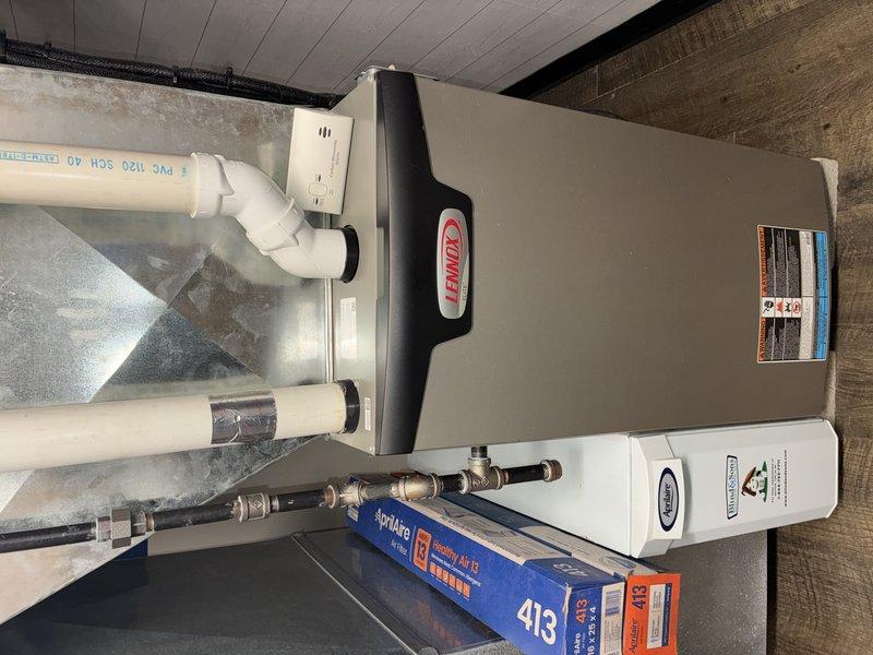 Performed routine maintenance on 4-year-old Lennox heating system. Inspected PVC venting, ductwork connections, and verified proper installation of secondary components. Checked Aprilaire humidistat settings, confirming control was set to "NORMAL" position with proper wire connections to terminals HH and ODT.