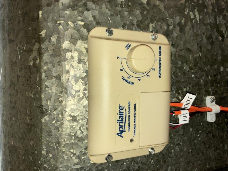 Performed routine maintenance on 4-year-old Lennox heating system. Inspected PVC venting, ductwork connections, and verified proper installation of secondary components. Checked Aprilaire humidistat settings, confirming control was set to "NORMAL" position with proper wire connections to terminals HH and ODT.