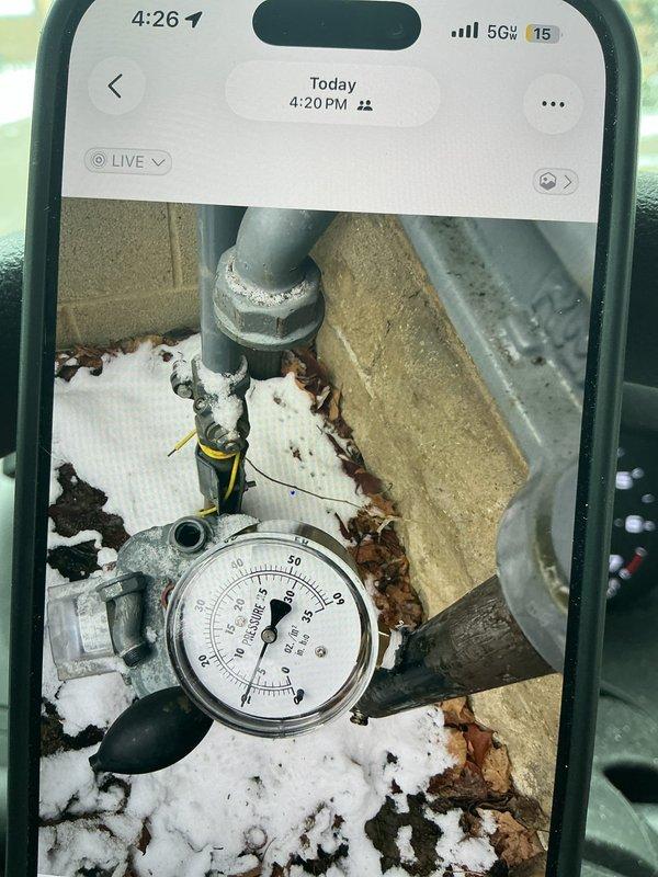 Responded to a reported gas leak. Performed pressure test on gas lines with gauge showing reading between 5-10 PSI. Enbridge technician confirmed leak was still present after initial inspection. Documented system conditions with photos showing frost accumulation on pipes and fittings.