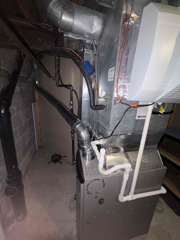 Installed new high-efficiency furnace system with integrated AprilAire humidifier. Completed all necessary ductwork connections, installed PVC condensate drainage lines, and properly wired the humidifier control panel. System is fully operational with humidity control set to maintain optimal indoor comfort levels.