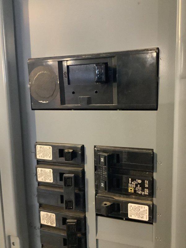 Responded to service call for non-functioning garage doors and radon fan. Upon inspection, identified and reset tripped circuit breaker in main electrical panel that supplies power to these systems. Noted accumulation of debris (wood shavings/sawdust) at bottom of panel which was removed to prevent potential electrical hazards.