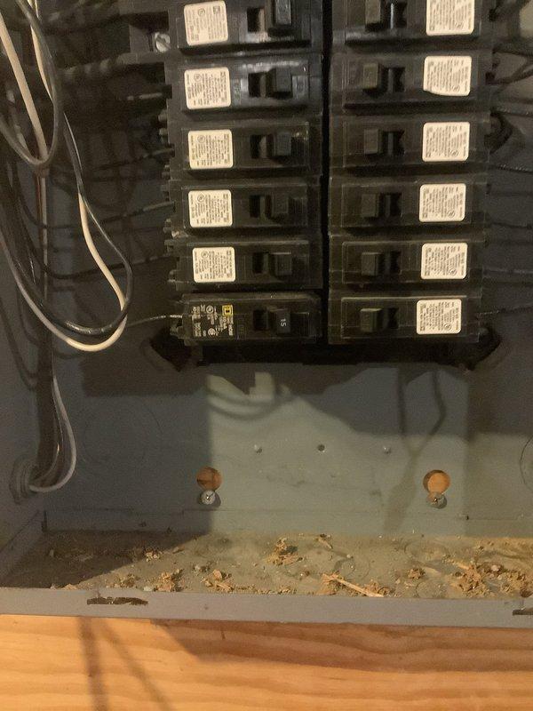 Responded to service call for non-functioning garage doors and radon fan. Upon inspection, identified and reset tripped circuit breaker in main electrical panel that supplies power to these systems. Noted accumulation of debris (wood shavings/sawdust) at bottom of panel which was removed to prevent potential electrical hazards.