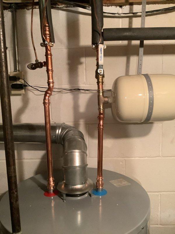 Successfully replaced a 50-gallon water heater under warranty. Installed new copper supply lines, properly connected ventilation duct, and verified the expansion tank was functioning correctly. All connections tested with no leaks detected and system operating to manufacturer specifications.