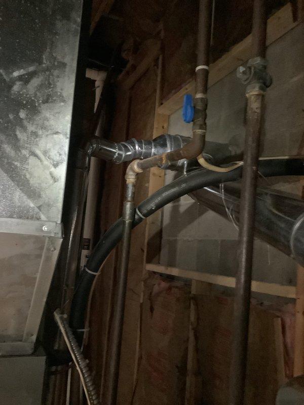 Conducted comprehensive assessment of existing HVAC system for pre-sale home evaluation. Documented aging furnace unit with connected PVC venting, adjacent water heater, and auxiliary air quality equipment. Inspection revealed copper piping infrastructure and ductwork requiring attention, with particular focus on the evaporator coil housing and ventilation connections. Recommended complete system replacement to address age-related concerns and improve home marketability.