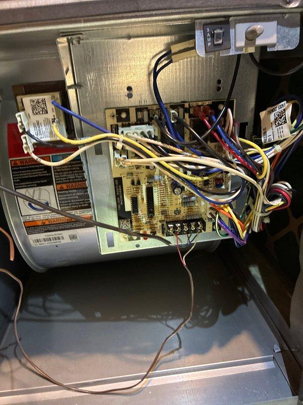 Performed scheduled maintenance on heating system, including inspection of internal circuit board and electrical connections. Utilized hex tool to access and examine control board components, verifying proper wire connections and terminal integrity. All electronic components were found to be in normal working condition with no visible issues detected.