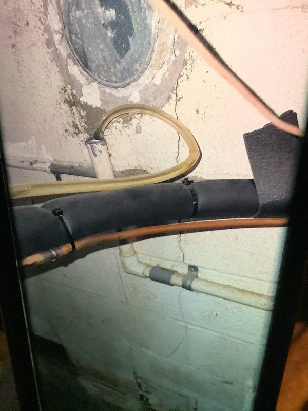 Performed routine maintenance inspection on 2-year-old furnace under current MVP coverage. Inspected internal components including gas valve assembly, fan motor, and electrical connections which were found in proper working condition. Noted some moisture damage on basement wall near plumbing connections that should be monitored but doesn't affect furnace operation.