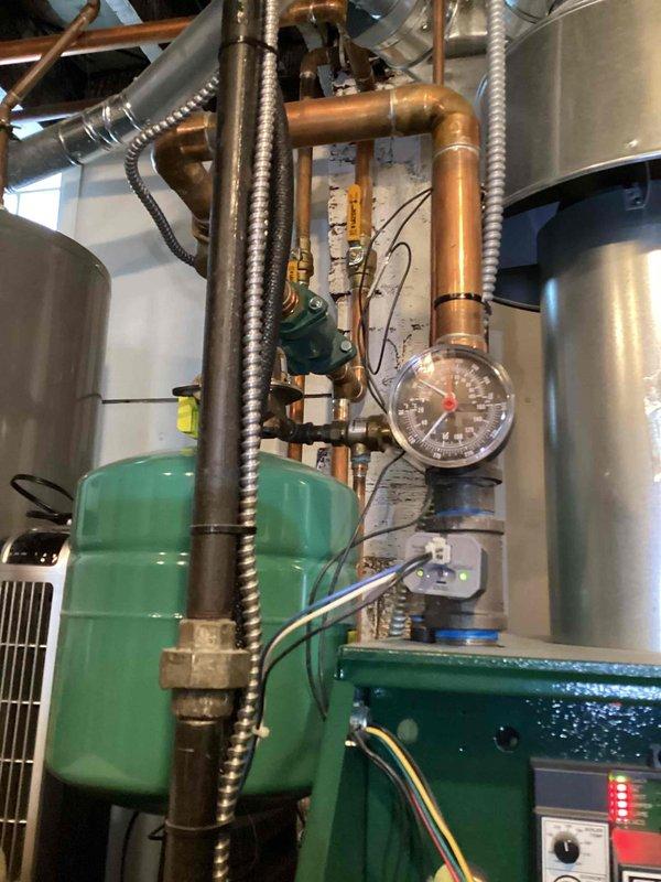 Performed scheduled maintenance on a 3-year-old boiler system. Inspected copper piping infrastructure, pressure gauge readings, and expansion tank condition. Verified proper operation of the pressure reducing valve and examined all connection points for leaks or signs of wear.