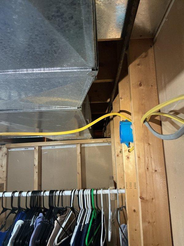 Conducted site assessment for new water softener system installation in 1991 residential property. Inspected unfinished ceiling area with exposed ductwork and electrical components, and evaluated basement storage area with concrete flooring to determine optimal equipment placement. Provided customer with comprehensive system options based on home's age and water quality requirements.