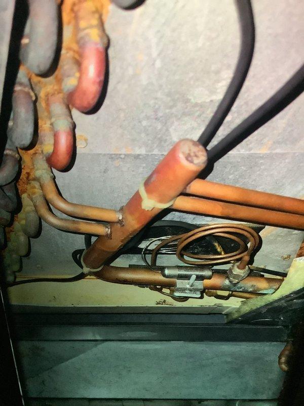 Performed scheduled maintenance check on heating system for MVP customer. Inspected copper piping and connections, noting oxidation and corrosion at several joints. Examined mechanical components and identified dust accumulation in ventilation channels that required cleaning for optimal system performance.