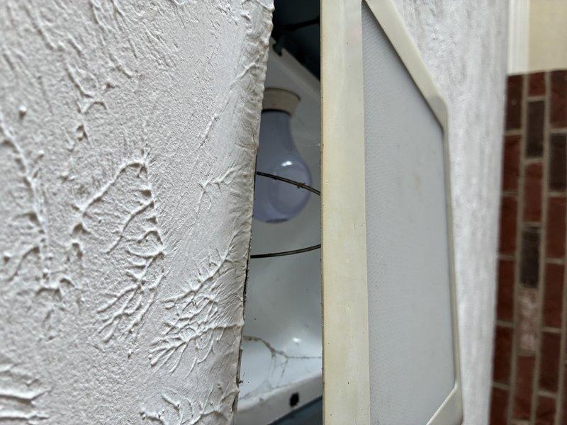Removed legacy alarm system wiring and successfully installed new light fixture, ensuring proper electrical connections and secure mounting to the textured wall surface. Verified fixture operation and confirmed proper illumination with customer before completing service.