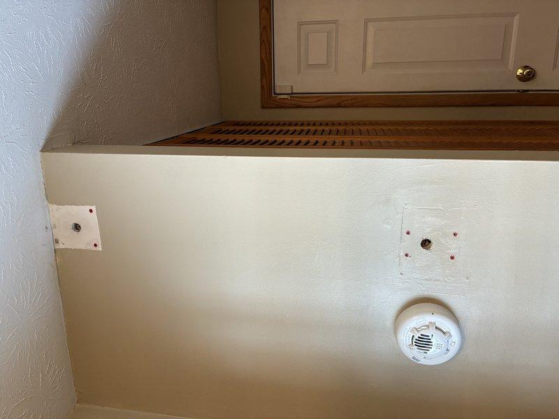 Removed legacy alarm system wiring and successfully installed new light fixture, ensuring proper electrical connections and secure mounting to the textured wall surface. Verified fixture operation and confirmed proper illumination with customer before completing service.