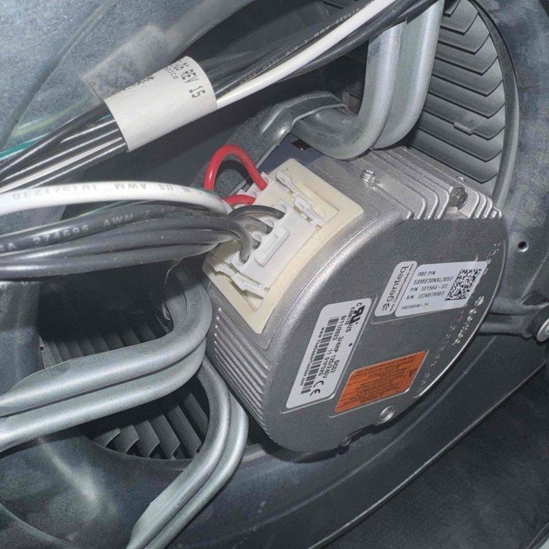 Completed standard furnace tune-up service including inspection of blower wheel assembly and motor. Both components showed no signs of damage or excessive wear. Motor connections and wiring were verified to be secure with proper terminal connections intact.