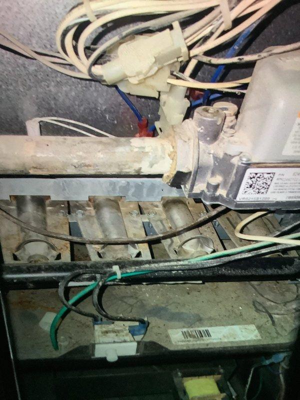 Performed routine MVP heating maintenance service, which had been rescheduled from previous date. Inspected electrical connections and terminal components, noting some wear on metal piping. Examined burner assembly and verified proper wire connections throughout the system.