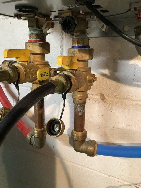 Successfully completed scheduled maintenance flush on Rinnai R75LS tankless water heater to remove scale buildup. Service included isolating the unit using the installed service valves, connecting flush kit to the cold and hot water lines, and circulating descaling solution through the heat exchanger to restore optimal performance and efficiency. Unit was tested after service and is functioning properly with no issues noted.