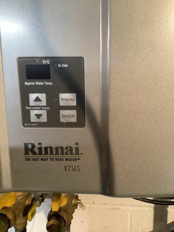 Successfully completed scheduled maintenance flush on Rinnai R75LS tankless water heater to remove scale buildup. Service included isolating the unit using the installed service valves, connecting flush kit to the cold and hot water lines, and circulating descaling solution through the heat exchanger to restore optimal performance and efficiency. Unit was tested after service and is functioning properly with no issues noted.