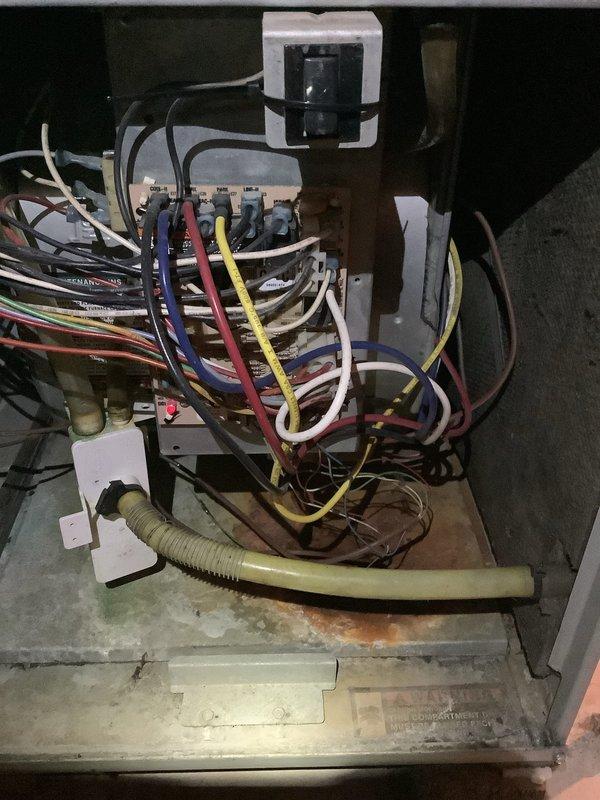 Responded to emergency no-heat call for a 25-year-old furnace showing signs of wear and corrosion. Upon inspection of the blower motor assembly and electrical control panel, diagnosed and replaced failing components, restoring proper heating function to this aging system.