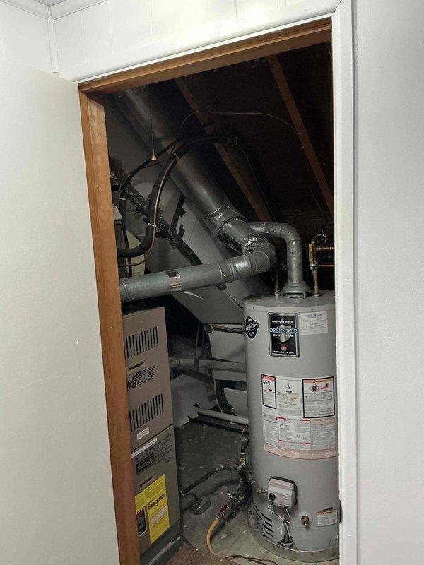 Successfully completed installation of a new 80% FRN furnace and AC system in the client's utility closet. System includes SX Ultra heating unit with properly connected ductwork, PVC venting, and integration with existing water heater. All connections were properly sealed with foil tape and the complete system was tested for proper operation.