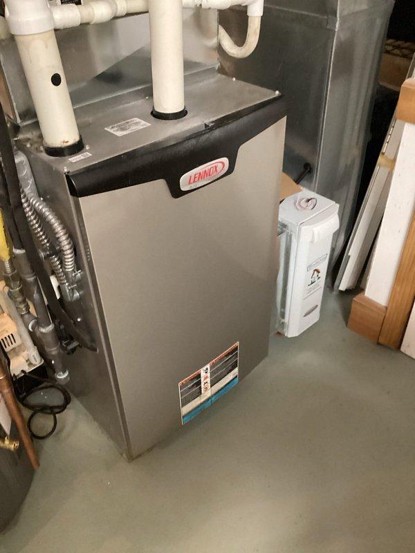 Performed standard furnace tune-up on 7-year-old Lennox heating system, which included inspection and maintenance of all components. System appears in good condition with proper installation of PVC venting. Also inspected the Aprilaire whole-home humidifier system, verifying proper operation of the digital control panel and water supply connections.