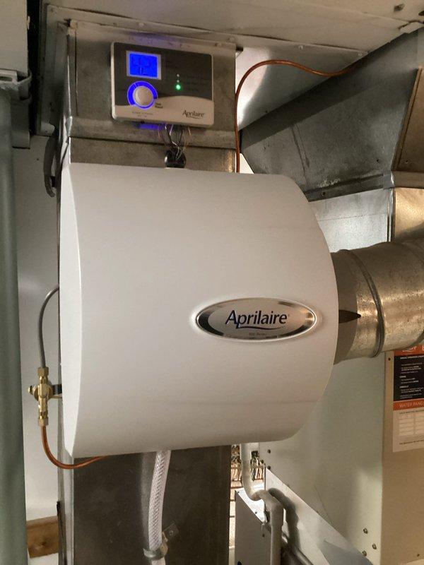 Performed standard furnace tune-up on 7-year-old Lennox heating system, which included inspection and maintenance of all components. System appears in good condition with proper installation of PVC venting. Also inspected the Aprilaire whole-home humidifier system, verifying proper operation of the digital control panel and water supply connections.