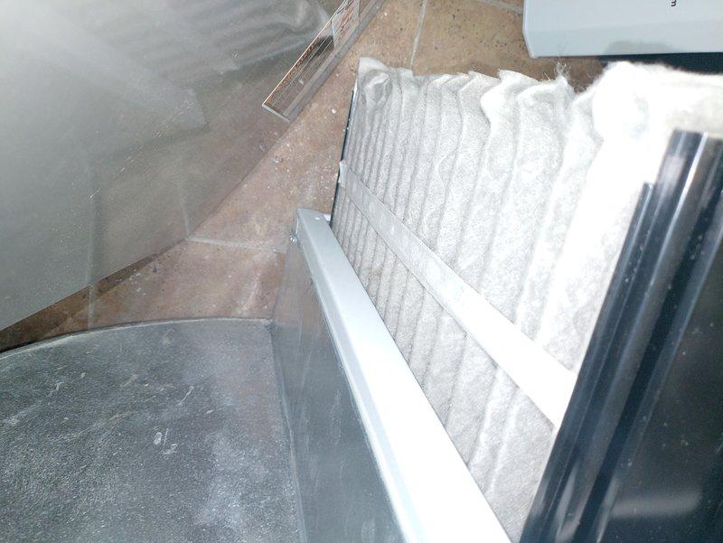 Performed scheduled furnace tune-up service. Inspected blower wheel assembly for proper operation and cleanliness, confirming good condition with no obstructions. Replaced air filter with new unit and verified proper installation in housing frame.