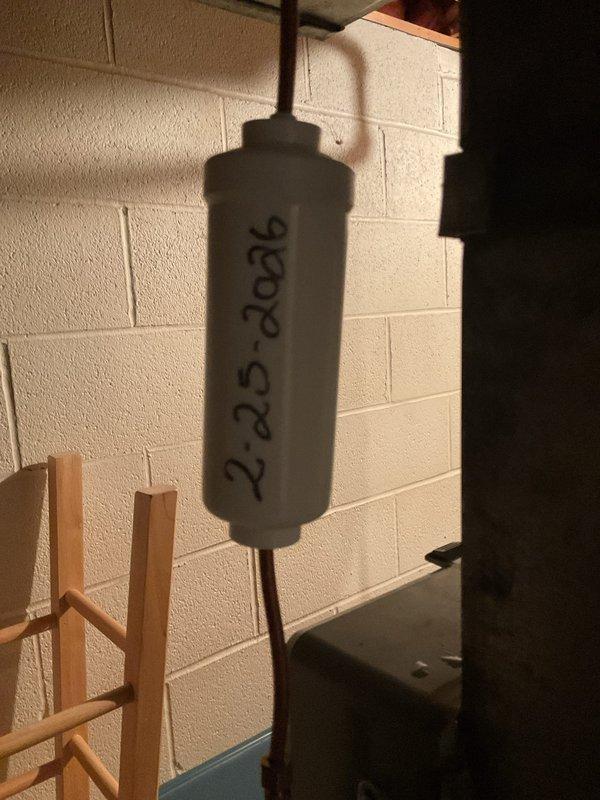 Performed furnace maintenance tune-up on 10-year-old system and diagnosed malfunctioning humidifier. Found evaporative pad severely clogged, restricting water flow through distribution tube, which was causing frequent filter clogging issues. Replaced humidifier pad and restored proper water distribution function.