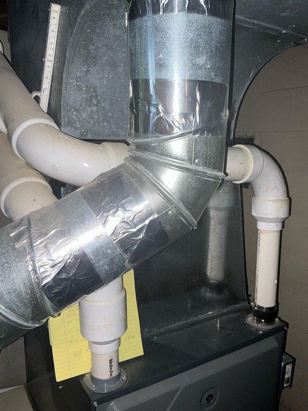 Conducted a furnace replacement estimate on a 13-year-old system. Inspected existing HVAC setup including metal ductwork, PVC venting/drainage, and connection points. Photographed current installation to document system configuration and space constraints for proper replacement unit sizing.