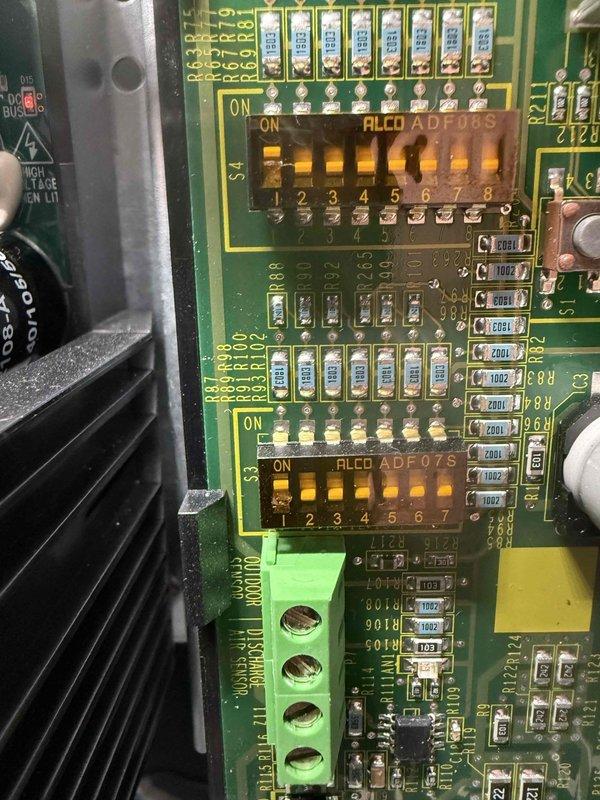 Performed routine furnace maintenance including inspection of control board circuitry. Examined DIP switch settings on ALCO ADF08S and ADF07S arrays and verified proper configuration. Inspected power supply module, terminal connections, and wiring harness for proper routing and secure connections, with all components found in good working condition.