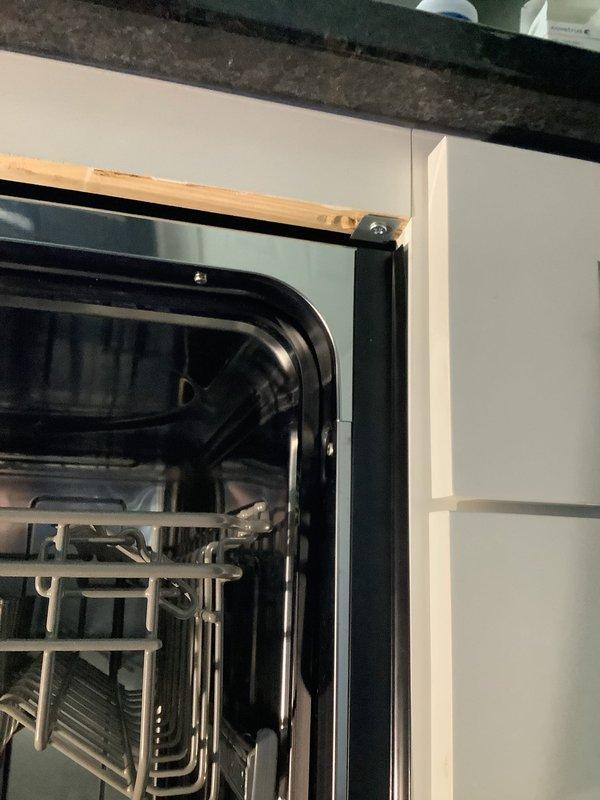 Completed customer-supplied dishwasher installation in kitchen with white cabinetry. Properly connected water supply, secured unit within cabinet space, and verified functional operation. Final installation included proper alignment with surrounding cabinetry and operational testing of control panel.