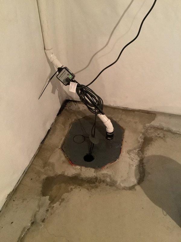 Successfully installed new PVC discharge piping from customer's sump pump to exterior connection, replacing the existing line. Installed a code-required check valve to prevent backflow and ensure proper system operation. Verified system functionality with no leaks observed.