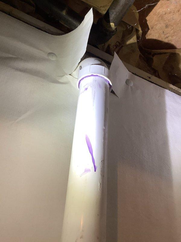 Successfully installed new PVC discharge piping from customer's sump pump to exterior connection, replacing the existing line. Installed a code-required check valve to prevent backflow and ensure proper system operation. Verified system functionality with no leaks observed.