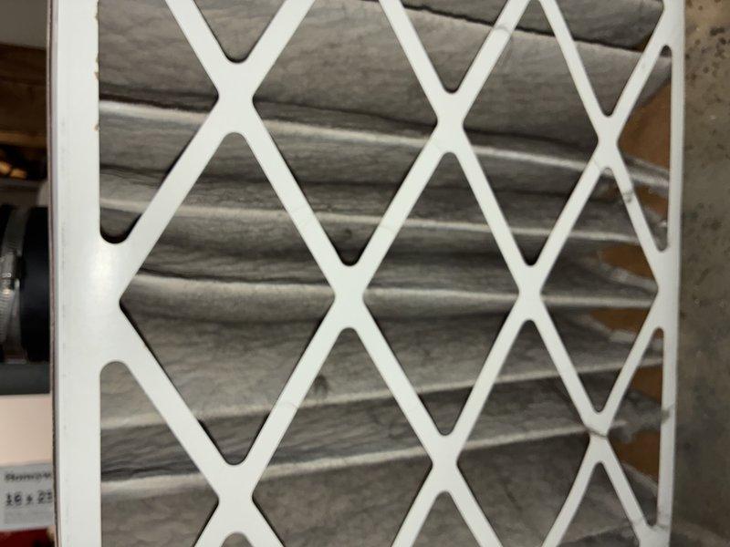Performed scheduled MVP furnace maintenance service including comprehensive inspection of the heating system. Documented significant dust accumulation on the primary air filter which showed visible darkening of the pleated media, as well as substantial brownish-orange particulate buildup on the secondary filtration component with diamond mesh pattern. Both filters were cleaned/replaced to ensure optimal system performance and airflow.