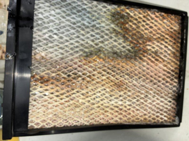 Performed scheduled MVP furnace maintenance service including comprehensive inspection of the heating system. Documented significant dust accumulation on the primary air filter which showed visible darkening of the pleated media, as well as substantial brownish-orange particulate buildup on the secondary filtration component with diamond mesh pattern. Both filters were cleaned/replaced to ensure optimal system performance and airflow.
