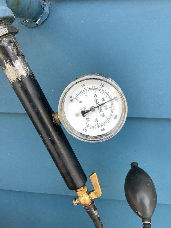 Responded to a gas leak service call where the utility company had already shut off gas supply to the property. Conducted pressure testing on the gas line using a calibrated gauge, which revealed pressure readings between 13-15 PSI, indicating a leak in the system. Testing confirmed the presence of a gas leak that prevented safe restoration of service, leaving the property without heat and hot water until repairs are completed.