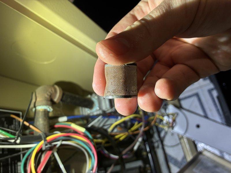 Performed standard boiler tune-up service including inspection and cleaning of mesh filter component. Examined Taco control module and associated wiring connections to ensure proper functionality. System returned to normal operating condition after service.